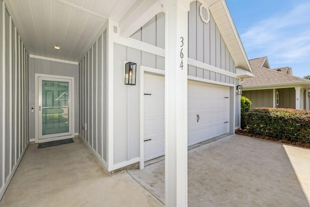 364 Lightning Bug Ln, Freeport, FL 32439 - view of side of property with board and batten siding, driveway, roof with shingles, and an attached garage