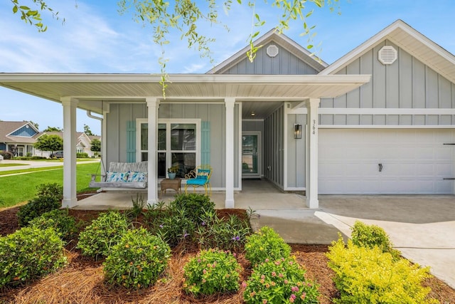 364 Lightning Bug Ln, Freeport, FL 32439 - single story home featuring board and batten siding, covered porch, a garage, and concrete driveway