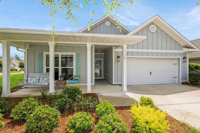 364 Lightning Bug Ln, Freeport, FL 32439 - single story home with board and batten siding, covered porch, a garage, and concrete driveway
