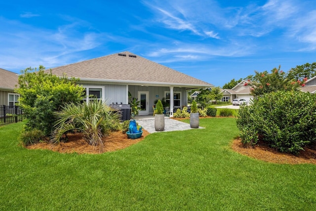 364 Lightning Bug Ln, Freeport, FL 32439 - rear view of property with a patio area, board and batten siding, and a shingled roof