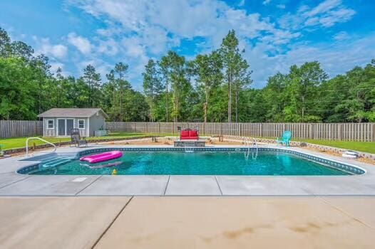 2405 Dakota Way, Crestview, FL 32536 - view of pool with a patio, a fenced backyard, and an outbuilding