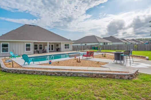 2405 Dakota Way, Crestview, FL 32536 - view of swimming pool featuring a patio area and a fenced backyard