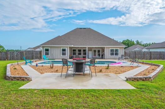 2405 Dakota Way, Crestview, FL 32536 - back of house featuring a fenced backyard, french doors, and a patio