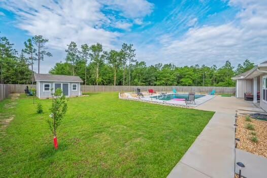2405 Dakota Way, Crestview, FL 32536 - fenced backyard featuring an outbuilding and a patio