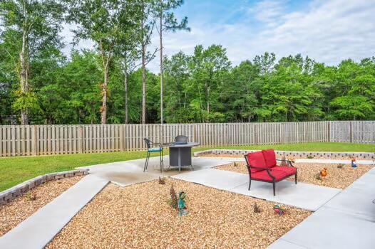2405 Dakota Way, Crestview, FL 32536 - fenced backyard with a patio area