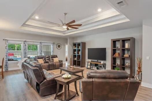 2405 Dakota Way, Crestview, FL 32536 - living room with a raised ceiling, ceiling fan, light wood-style flooring, crown molding, and recessed lighting