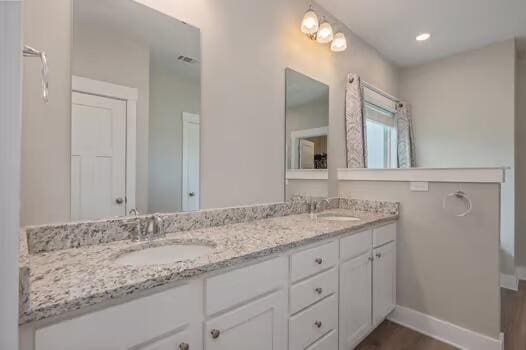 2405 Dakota Way, Crestview, FL 32536 - bathroom with double vanity and wood finished floors