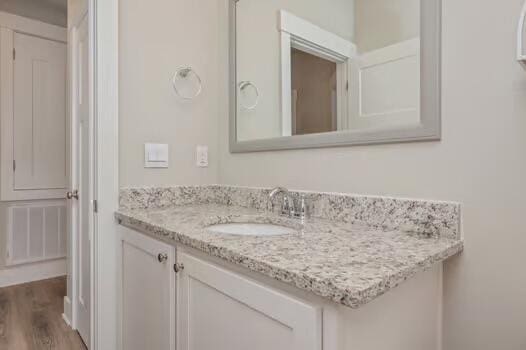 2405 Dakota Way, Crestview, FL 32536 - bathroom with vanity and wood finished floors