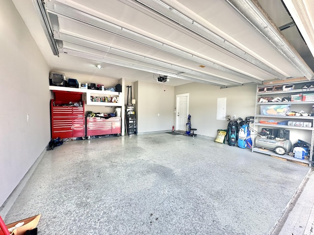2405 Dakota Way, Crestview, FL 32536 - garage featuring a garage door opener and baseboards