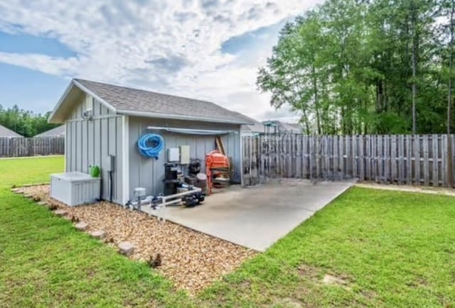 2405 Dakota Way, Crestview, FL 32536 - fenced backyard with a patio area and an outbuilding