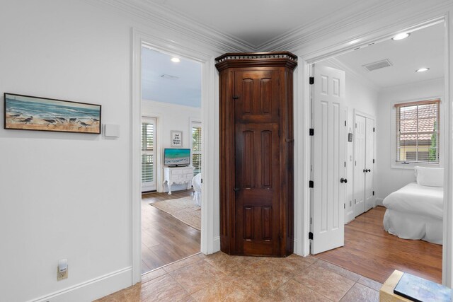 176 Rue Martine, Miramar Beach, FL 32550 - corridor featuring crown molding, light tile patterned floors, and recessed lighting