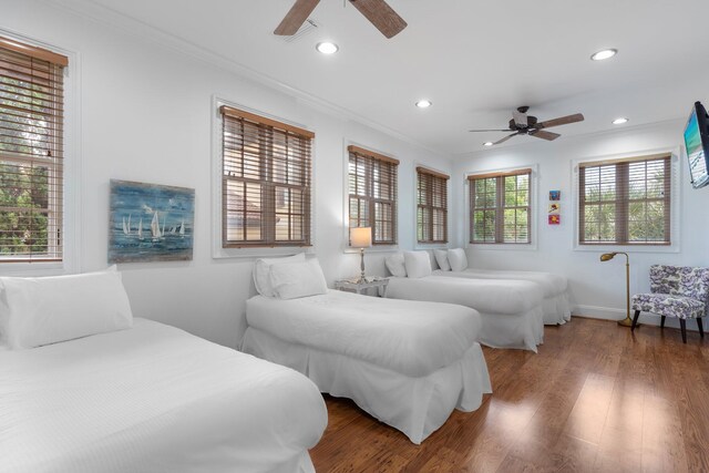 176 Rue Martine, Miramar Beach, FL 32550 - bedroom featuring crown molding, recessed lighting, wood finished floors, and a ceiling fan