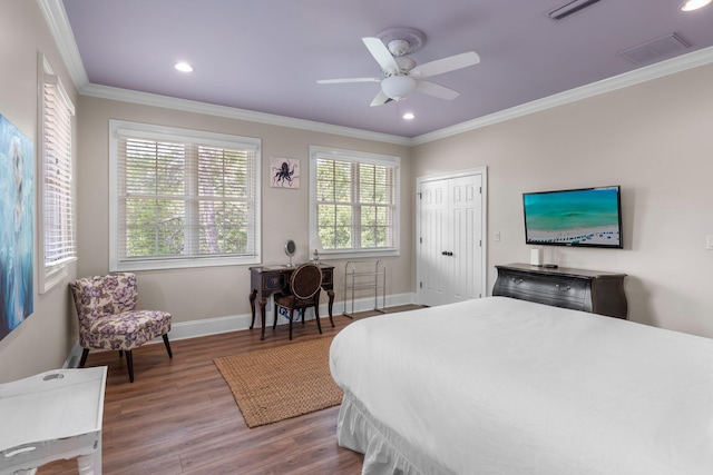 176 Rue Martine, Miramar Beach, FL 32550 - bedroom featuring crown molding, wood finished floors, recessed lighting, a closet, and ceiling fan