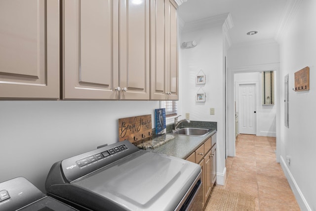 176 Rue Martine, Miramar Beach, FL 32550 - laundry room with cabinet space, crown molding, washing machine and dryer, and light tile patterned floors