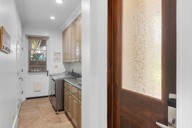 176 Rue Martine, Miramar Beach, FL 32550 - laundry room with cabinet space, washing machine and dryer, ornamental molding, light tile patterned floors, and recessed lighting