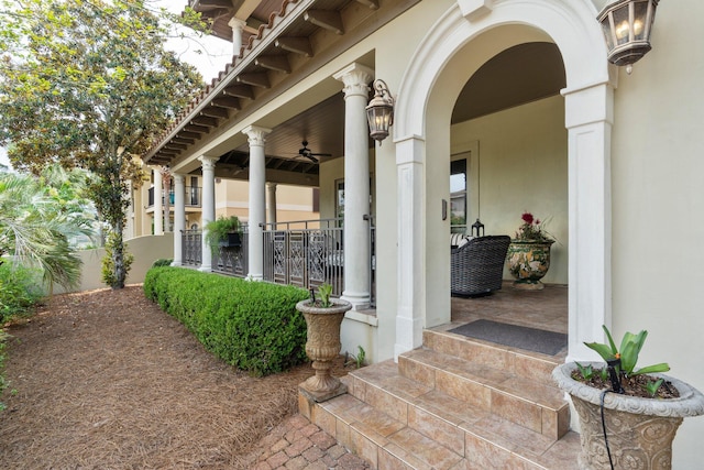 176 Rue Martine, Miramar Beach, FL 32550 - entrance to property with covered porch, stucco siding, and a ceiling fan