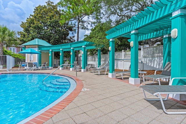 176 Rue Martine, Miramar Beach, FL 32550 - community pool with a pergola and a patio area