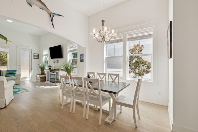 234 Grande Pointe Cir, Inlet Beach, FL 32461 - dining room featuring light wood-style floors and a chandelier