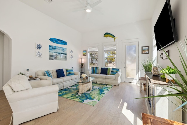 234 Grande Pointe Cir, Inlet Beach, FL 32461 - living area featuring a ceiling fan, wood finished floors, and arched walkways