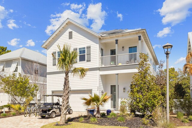 234 Grande Pointe Cir, Inlet Beach, FL 32461 - view of front facade featuring a balcony, an attached garage, and driveway