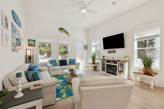 234 Grande Pointe Cir, Inlet Beach, FL 32461 - living room featuring ceiling fan, wood finished floors, and a glass covered fireplace