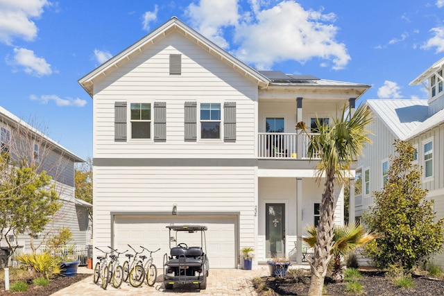 234 Grande Pointe Cir, Inlet Beach, FL 32461 - view of front of house with a balcony, solar panels, a garage, and driveway