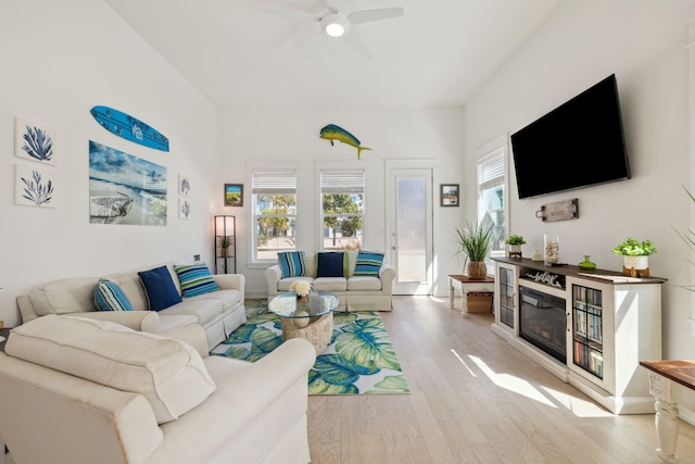 234 Grande Pointe Cir, Inlet Beach, FL 32461 - living room with a ceiling fan, wood finished floors, and a glass covered fireplace