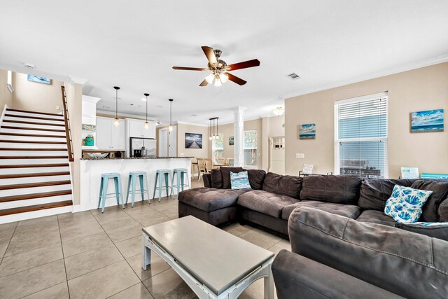 211 Tahitian Way, Destin, FL 32541 - living area featuring ceiling fan, stairs, light tile patterned floors, and crown molding