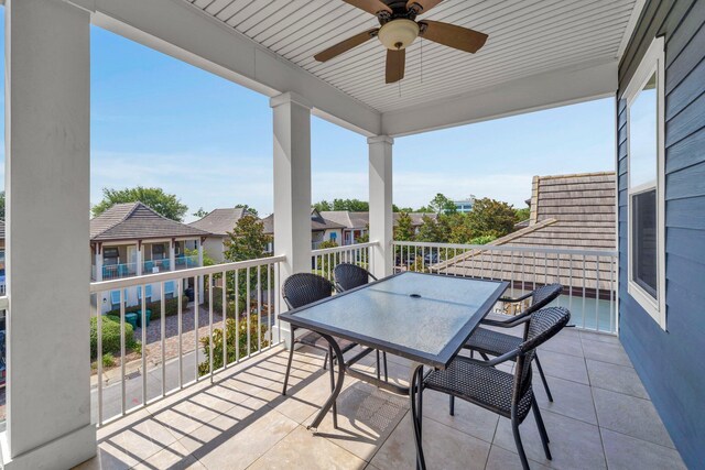 211 Tahitian Way, Destin, FL 32541 - balcony featuring a ceiling fan, outdoor dining area, and a residential view