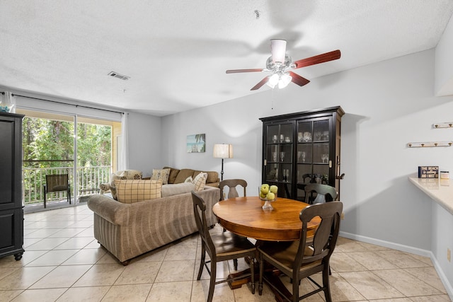 200 Sandestin Ln Apt 1209, Miramar Beach, FL 32550 - dining room featuring ceiling fan, light tile patterned flooring, and a textured ceiling