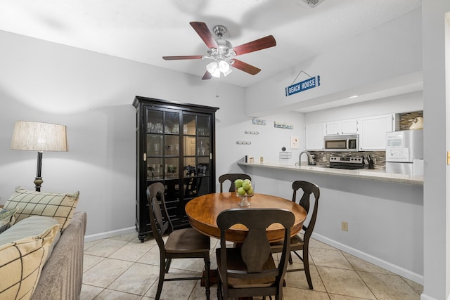 200 Sandestin Ln Apt 1209, Miramar Beach, FL 32550 - dining room with light tile patterned floors and a ceiling fan