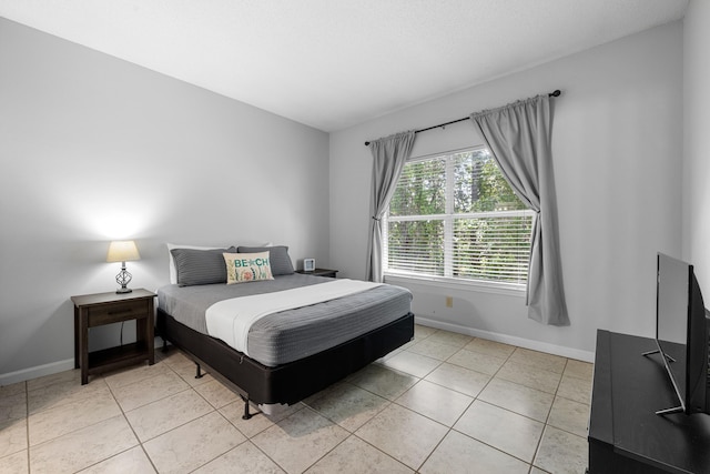 200 Sandestin Ln Apt 1209, Miramar Beach, FL 32550 - bedroom with baseboards and light tile patterned floors