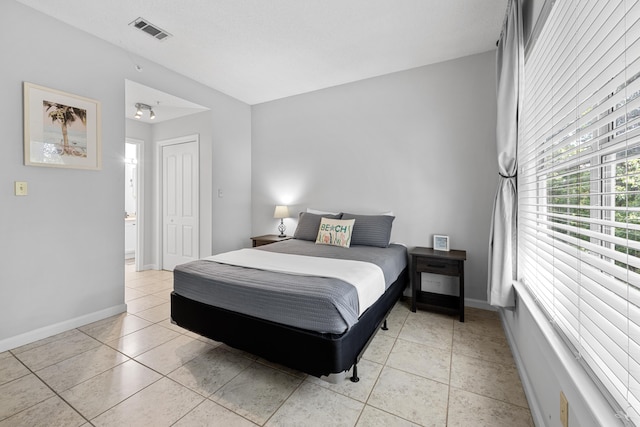 200 Sandestin Ln Apt 1209, Miramar Beach, FL 32550 - bedroom with light tile patterned floors and a closet