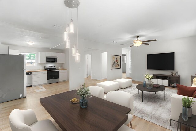 1023 W Webster Dr, Pensacola, FL 32505 - living area with a ceiling fan and light wood-type flooring