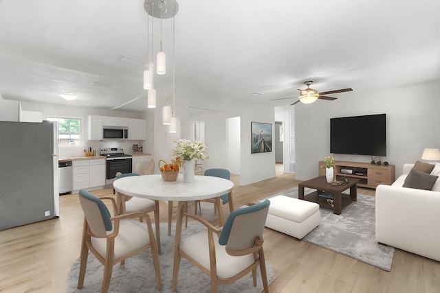 1023 W Webster Dr, Pensacola, FL 32505 - dining space with light wood-style floors and a ceiling fan