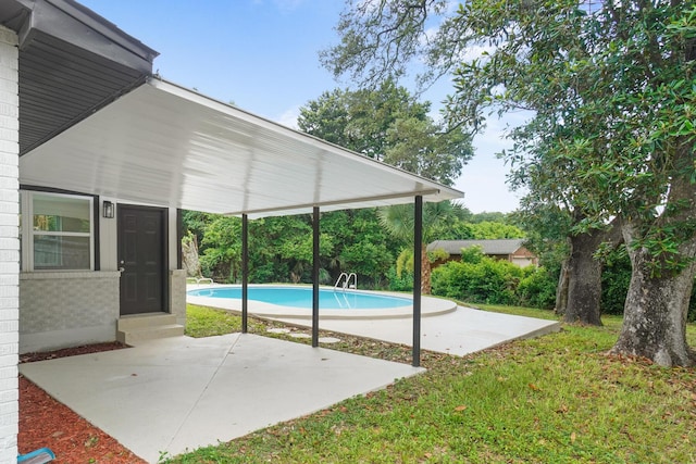 1023 W Webster Dr, Pensacola, FL 32505 - swimming pool with a patio area and a lawn