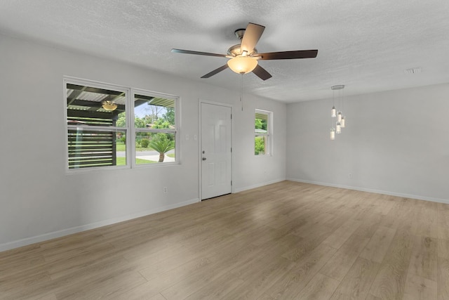 1023 W Webster Dr, Pensacola, FL 32505 - entryway with a textured ceiling, light wood-style flooring, and a ceiling fan