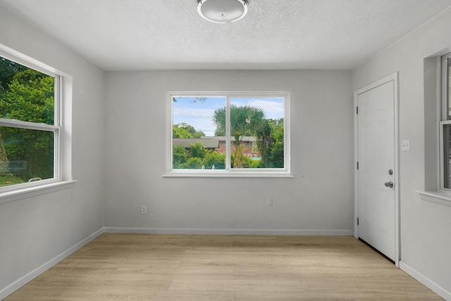 1023 W Webster Dr, Pensacola, FL 32505 - spare room featuring light wood-style floors and baseboards