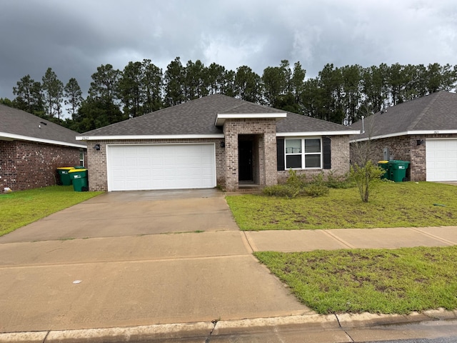 2825 Patriot Ridge Dr, Crestview, FL 32539 - single story home featuring brick siding, a garage, concrete driveway, a front lawn, and a shingled roof