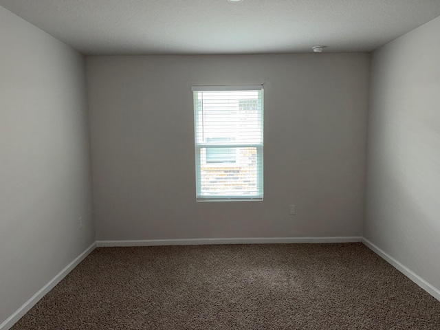 2825 Patriot Ridge Dr, Crestview, FL 32539 - carpeted empty room featuring baseboards and a smoke detector