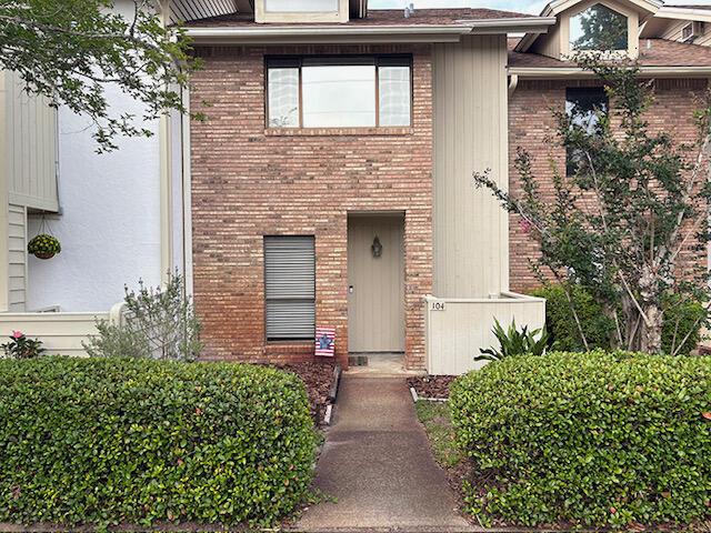 3861 Indian Trl Unit 104, Destin, FL 32541 - view of front of home featuring brick siding