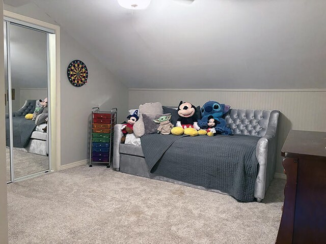 3861 Indian Trl Unit 104, Destin, FL 32541 - carpeted bedroom with lofted ceiling and a closet