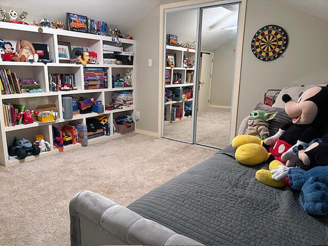 3861 Indian Trl Unit 104, Destin, FL 32541 - game room with carpet flooring and vaulted ceiling