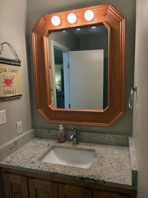 3861 Indian Trl Unit 104, Destin, FL 32541 - bathroom featuring vanity