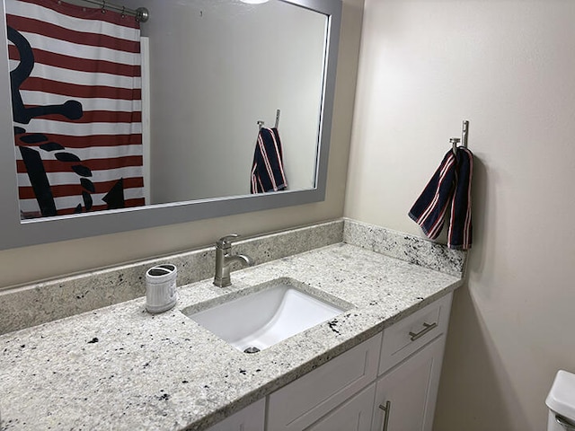 3861 Indian Trl Unit 104, Destin, FL 32541 - full bathroom with vanity and toilet