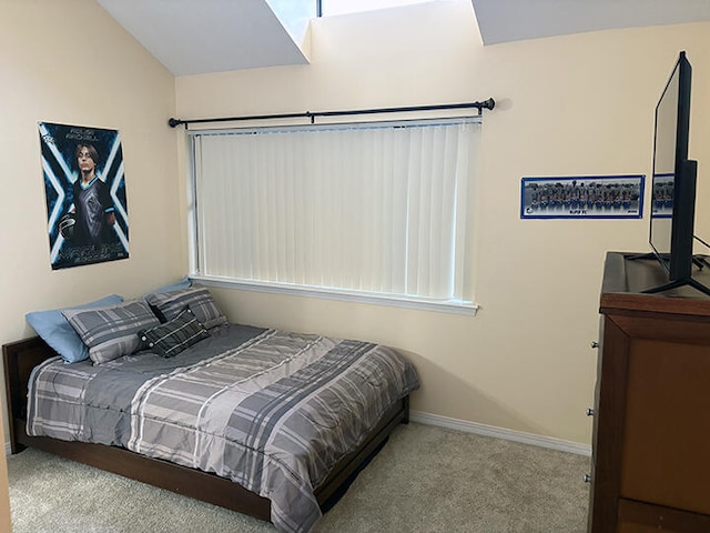 3861 Indian Trl Unit 104, Destin, FL 32541 - carpeted bedroom featuring baseboards and vaulted ceiling