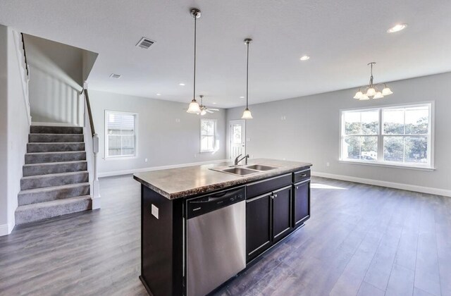 196 Johnson Ct, Crestview, FL 32536 - kitchen with stainless steel dishwasher, open floor plan, dark wood-style floors, recessed lighting, and a center island with sink