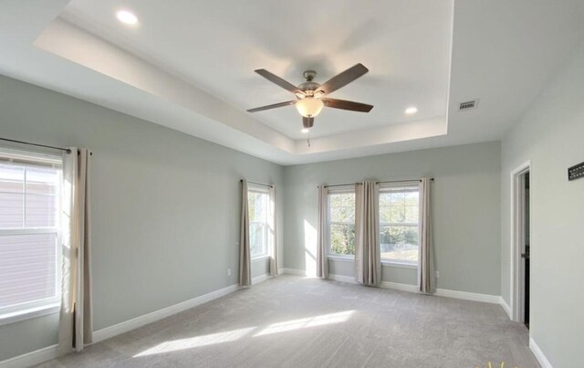 196 Johnson Ct, Crestview, FL 32536 - spare room with a tray ceiling, a ceiling fan, light carpet, and recessed lighting