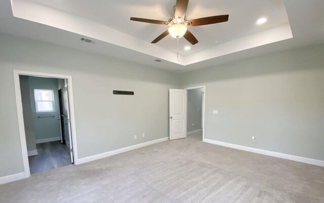 196 Johnson Ct, Crestview, FL 32536 - unfurnished bedroom with a tray ceiling, carpet, and recessed lighting