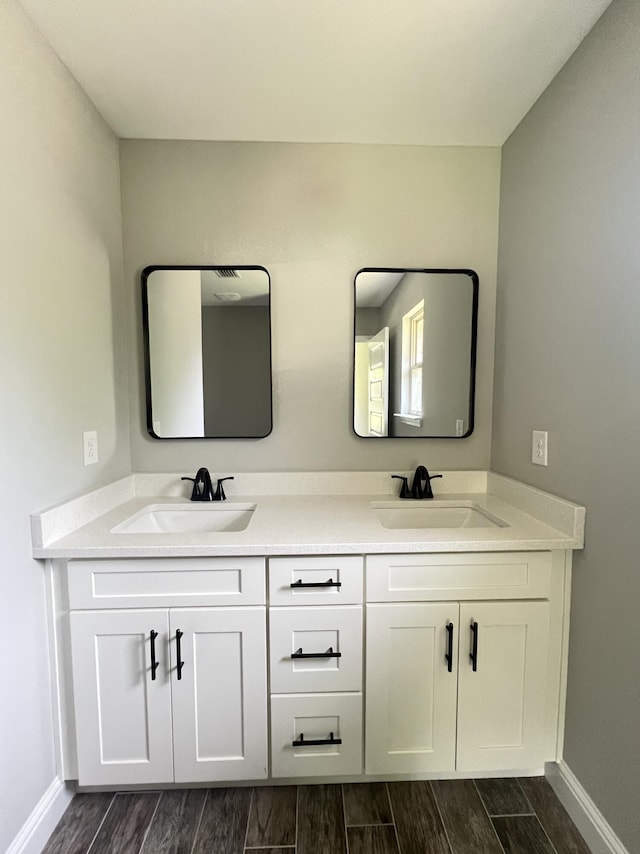 245 Cassady Ln, Crestview, FL 32539 - bathroom with double vanity and wood finished floors